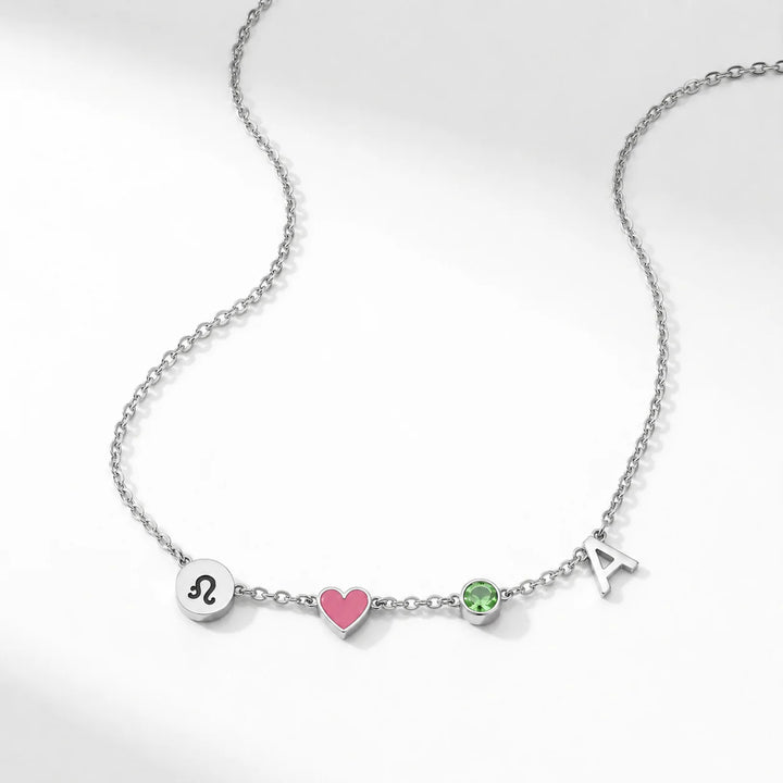 COLLIER AVEC INITIALE EN FORME DE CŒUR