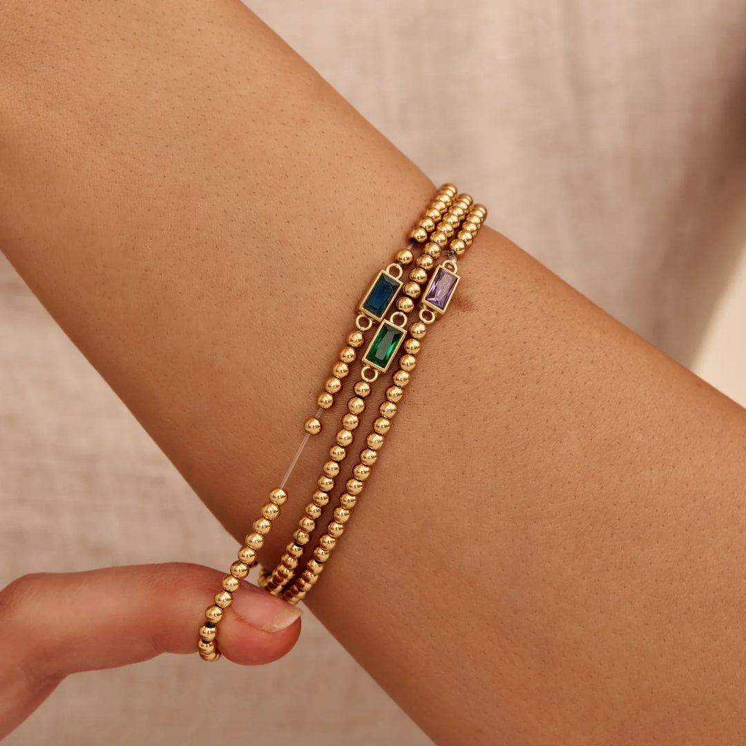 BRACELET EN PERLES D'OR AVEC PIERRES DE NAISSANCE