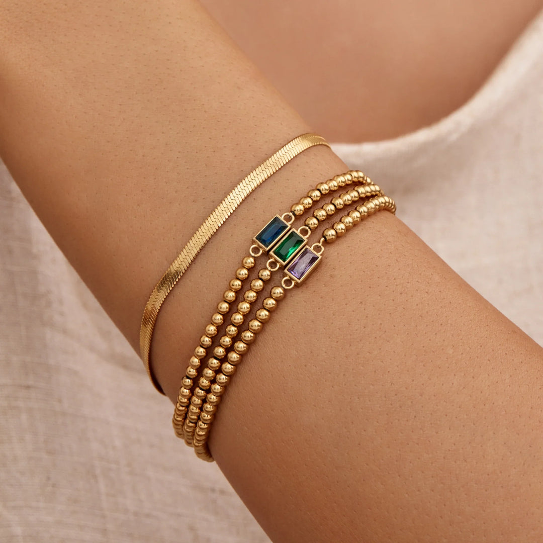 BRACELET EN PERLES D'OR AVEC PIERRES DE NAISSANCE