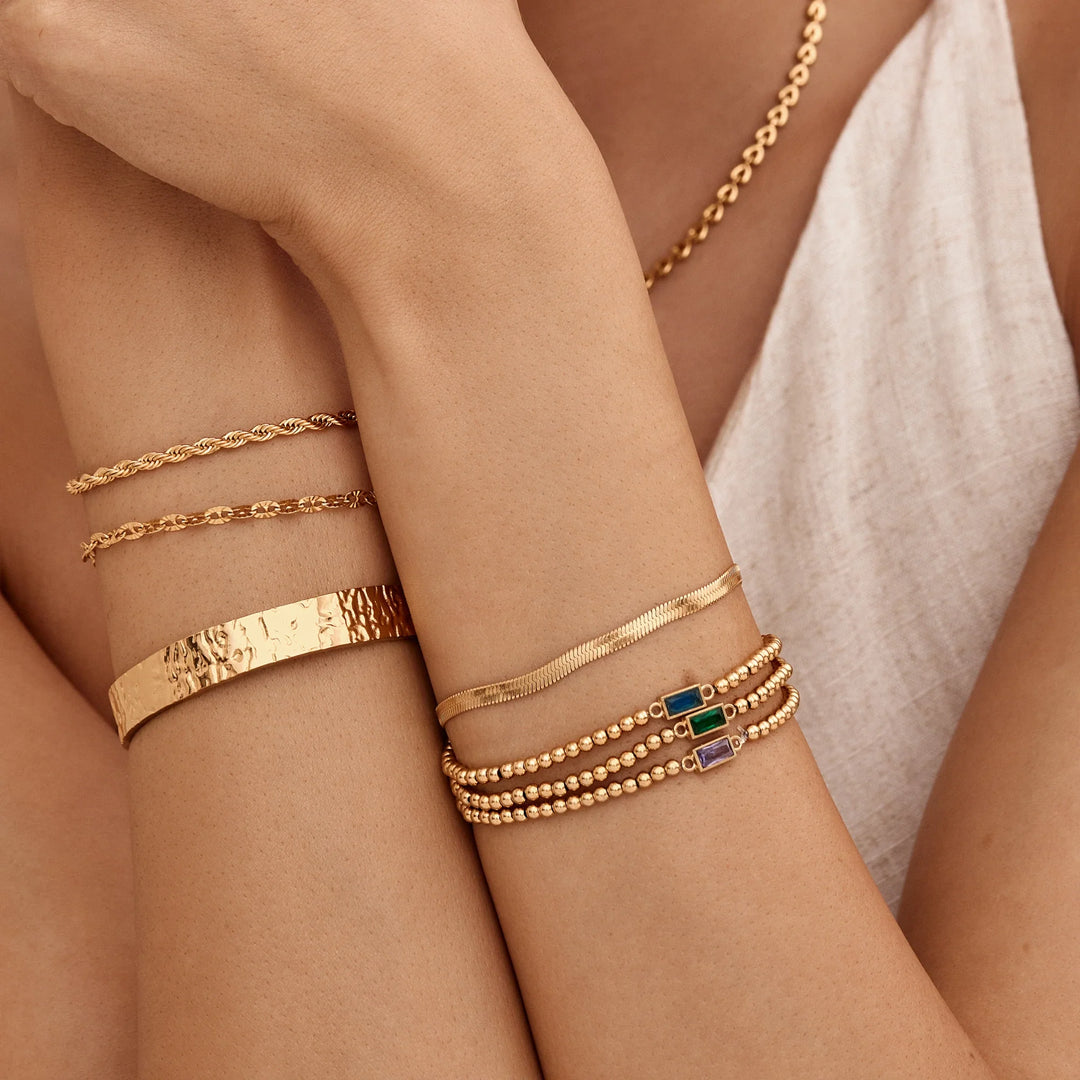 BRACELET EN PERLES D'OR AVEC PIERRES DE NAISSANCE